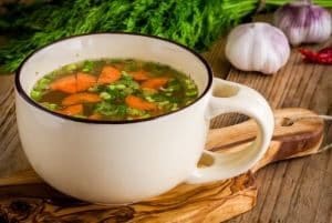 Cup of Chicken Vegetable Soup with Kale