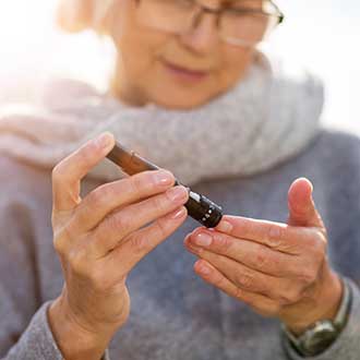 Women testing blood sugar