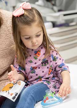 Pediatric Patient Looks at Anesthesiology Mask