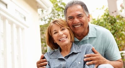 older couple smiling at the camera