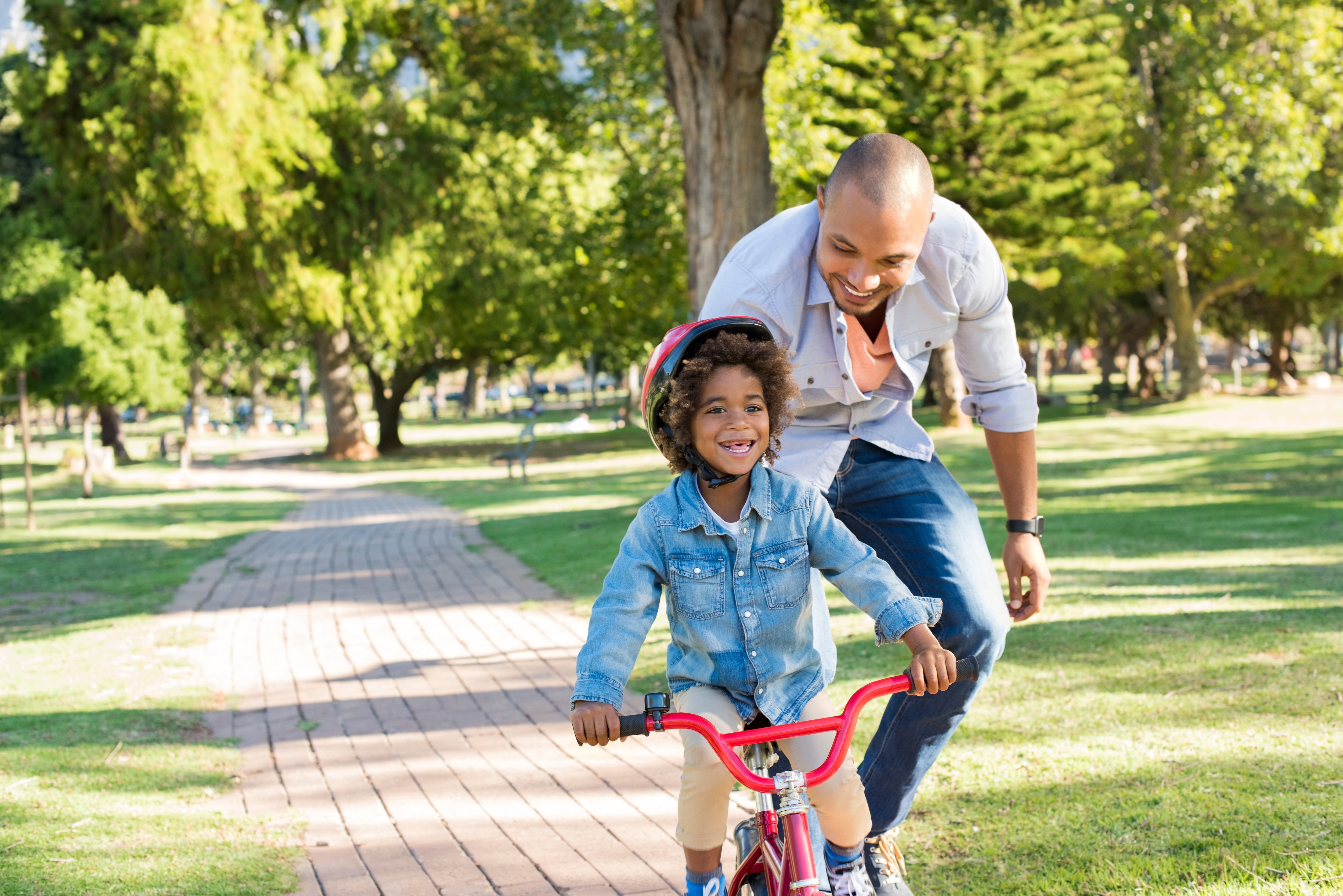 Man and child riding bikes